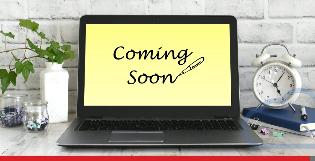 Laptop computer on a desk in a bright minimal modern office with Coming Soon on the screen Stock Photo, ft. arriving soon & coming soon - Envato