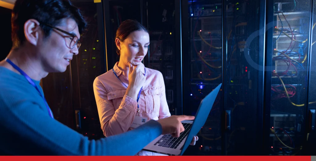 Diverse male and female engineers using laptop in computer server room Stock Photo, ft. server room & it services - Envato