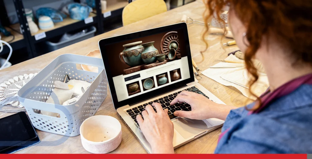 Female business owner using laptop in pottery studio workshop. Stock Photo, ft. websites & website template - Envato